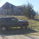 The XJ stands in front of an abandoned barn in MIssouri.